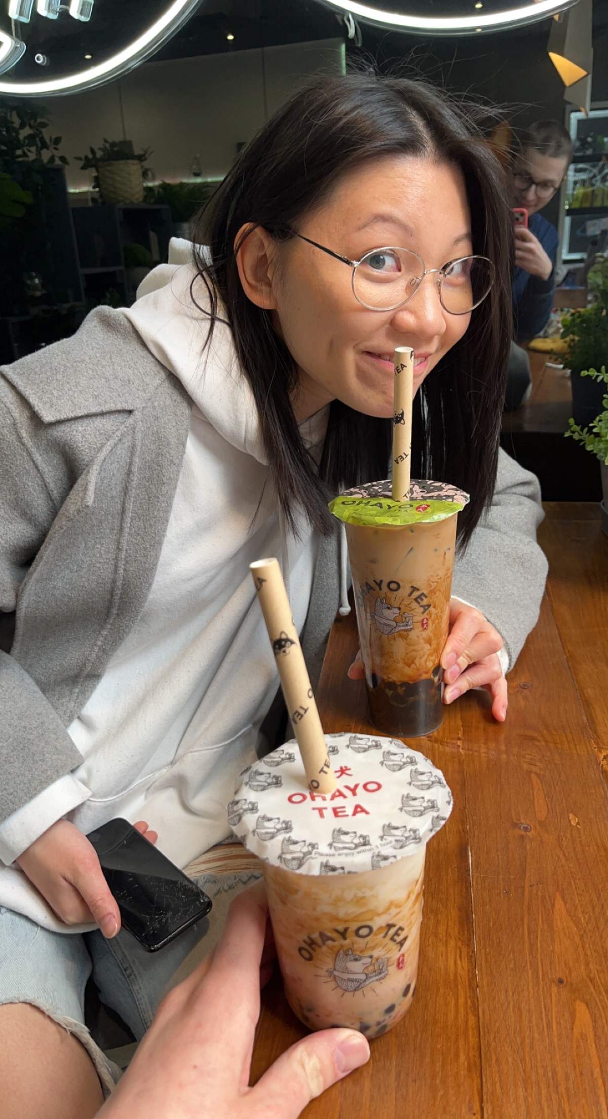 Thila holding a cup of bubble tea